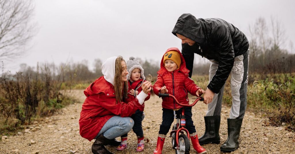 Happy family outdoors with children on a dirt path. Parents supporting kids on a bike ride.