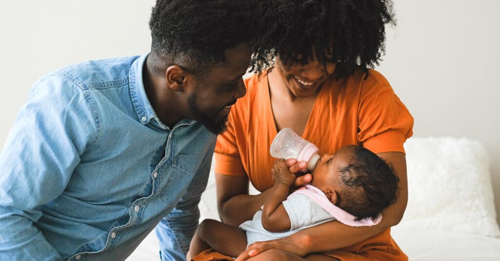 A joyful moment of parents feeding their baby using a bottle indoors.