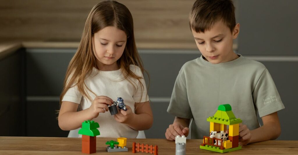 Two young children playing and assembling toys on a wooden table, fostering creativity.