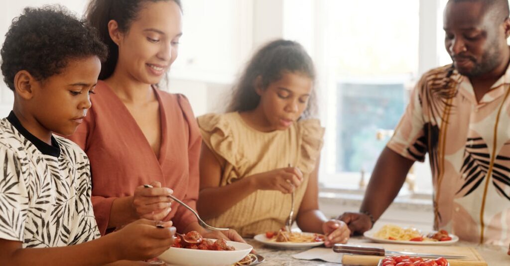 A happy family sharing a meal at home, emphasizing love and togetherness.